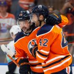EDMONTON, AB - SEPTEMBER 28: Devin Shore #14 and Brendan Perlini #42 of the Edmonton Oilers celebrate a goal against the Seattle Kraken during the second period in a preseason game at Rogers Place on September 28, 2021 in Edmonton, Canada. (Photo by Codie McLachlan/Getty Images)