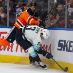 EDMONTON, AB - SEPTEMBER 28: Darnell Nurse #25 of the Edmonton Oilers battles against Will Borgen #3 of the Seattle Kraken during the second period in a preseason game at Rogers Place on September 28, 2021 in Edmonton, Canada. (Photo by Codie McLachlan/Getty Images)