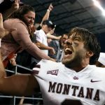 SEATTLE, WASHINGTON - SEPTEMBER 04: Camron Humphrey #2 of the Montana Grizzlies celebrates with fans after defeating Washington Huskies 13-7 at Husky Stadium on September 04, 2021 in Seattle, Washington. (Photo by Steph Chambers/Getty Images)