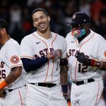 HOUSTON, TEXAS - SEPTEMBER 07: Carlos Correa #1 of the Houston Astros celebrates with manager Dusty Baker Jr. #12 of the Houston Astros after a walk-off double to beat the Seattle Mariners in the tenth inning at Minute Maid Park on September 07, 2021 in Houston, Texas. (Photo by Bob Levey/Getty Images)