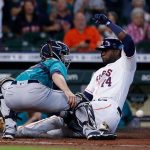 HOUSTON, TEXAS - SEPTEMBER 08: Yordan Alvarez #44 of the Houston Astros scores in the second inning on a double by Kyle Tucker #23 as Tom Murphy #2 of the Seattle Mariners can't handle the throw at Minute Maid Park on September 08, 2021 in Houston, Texas. (Photo by Bob Levey/Getty Images)