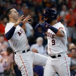 HOUSTON, TEXAS - SEPTEMBER 08: Marwin Gonzalez #9 of the Houston Astros celebrates with Carlos Correa #1 after hitting a two run home run in the second inning against the Seattle Mariners at Minute Maid Park on September 08, 2021 in Houston, Texas. (Photo by Bob Levey/Getty Images)
