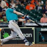 HOUSTON, TEXAS - SEPTEMBER 08: Jarred Kelenic #10 of the Seattle Mariners doubles in two runs in the seventh inning against the Houston Astros at Minute Maid Park on September 08, 2021 in Houston, Texas. (Photo by Bob Levey/Getty Images)
