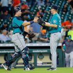 HOUSTON, TEXAS - SEPTEMBER 08: Cal Raleigh #29 of the Seattle Mariners shakes hands with Paul Sewald #37 after defeating the Houston Astros 8-5 at Minute Maid Park on September 08, 2021 in Houston, Texas. (Photo by Bob Levey/Getty Images)