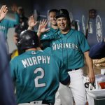 SEATTLE, WASHINGTON - SEPTEMBER 10: Marco Gonzales #7 high fives Tom Murphy #2 of the Seattle Mariners after Murphy's home run during the sixth inning against the Arizona Diamondbacks at T-Mobile Park on September 10, 2021 in Seattle, Washington. (Photo by Steph Chambers/Getty Images)