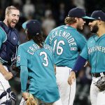 SEATTLE, WASHINGTON - SEPTEMBER 10: Tom Murphy #2, J.P. Crawford #3, Drew Steckenrider #16 and Abraham Toro #13 of the Seattle Mariners react after defeating the Arizona Diamondbacks 5-4 at T-Mobile Park on September 10, 2021 in Seattle, Washington. (Photo by Steph Chambers/Getty Images)