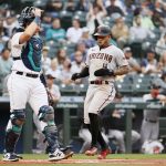 SEATTLE, WASHINGTON - SEPTEMBER 11: Ketel Marte #4 of the Arizona Diamondbacks scores a run against the Seattle Mariners during the first inning at T-Mobile Park on September 11, 2021 in Seattle, Washington. (Photo by Steph Chambers/Getty Images)