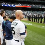 SEATTLE, WASHINGTON - SEPTEMBER 11: Kyle Seager #15 of the Seattle Mariners stands for the national anthem before the game against the Arizona Diamondbacks in honor of the 20th anniversary of the September 11, 2001 attacks at T-Mobile Park on September 11, 2021 in Seattle, Washington. (Photo by Steph Chambers/Getty Images)