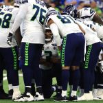 INDIANAPOLIS, INDIANA - SEPTEMBER 12: Russell Wilson #3 of the Seattle Seahawks huddles with the offense during the second quarter against the Indianapolis Colts at Lucas Oil Stadium on September 12, 2021 in Indianapolis, Indiana. (Photo by Justin Casterline/Getty Images)