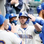 SEATTLE, WASHINGTON - SEPTEMBER 12: Mitch Haniger #17 of the Seattle Mariners reacts after his home run during the fourth inning against the Arizona Diamondbacks at T-Mobile Park on September 12, 2021 in Seattle, Washington. (Photo by Steph Chambers/Getty Images)