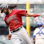 SEATTLE, WASHINGTON - SEPTEMBER 12: Henry Ramos #14 of the Arizona Diamondbacks reacts after scoring during the sixth inning against the Seattle Mariners at T-Mobile Park on September 12, 2021 in Seattle, Washington. (Photo by Steph Chambers/Getty Images)