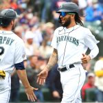 SEATTLE, WASHINGTON - SEPTEMBER 15: Tom Murphy #2 and J.P. Crawford #3 high five after scoring off a two-run double by Kyle Seager #15 of the Seattle Mariners to tie the game 3-3 against the Boston Red Sox in the third inning at T-Mobile Park on September 15, 2021 in Seattle, Washington. (Photo by Abbie Parr/Getty Images)