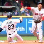 SEATTLE, WASHINGTON - SEPTEMBER 15: Rafael Devers #11 of the Boston Red Sox throws to first base after outing Ty France #23 of the Seattle Mariners to force a double play during the sixth inning at T-Mobile Park on September 15, 2021 in Seattle, Washington. (Photo by Abbie Parr/Getty Images)