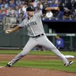 KANSAS CITY, MISSOURI - SEPTEMBER 17:  Chris Flexen #77 of the Seattle Mariners throws in the first inning against the Kansas City Royals at Kauffman Stadium on September 17, 2021 in Kansas City, Missouri. (Photo by Ed Zurga/Getty Images)