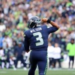 SEATTLE, WASHINGTON - SEPTEMBER 19: Quarterback Russell Wilson #3 of the Seattle Seahawks celebrates a second quarter touchdown in the game against the Tennessee Titans at Lumen Field on September 19, 2021 in Seattle, Washington. (Photo by Abbie Parr/Getty Images)