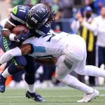 SEATTLE, WASHINGTON - SEPTEMBER 19: Running back Alex Collins #41 of the Seattle Seahawks of the Seattle Seahawks is tackled by strong safety Bradley McDougald #30 of the Tennessee Titans during the second quarter at Lumen Field on September 19, 2021 in Seattle, Washington. (Photo by Abbie Parr/Getty Images)