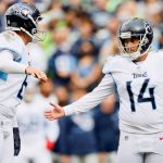 SEATTLE, WASHINGTON - SEPTEMBER 19: Kicker Randy Bullock #14 of the Tennessee Titans celebrates a first half field goal with punter Brett Kern #6 in the game against the Seattle Seahawks at Lumen Field on September 19, 2021 in Seattle, Washington. (Photo by Steph Chambers/Getty Images)