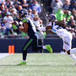 SEATTLE, WASHINGTON - SEPTEMBER 19: Wide receiver Tyler Lockett #16 of the Seattle Seahawks catches the ball over cornerback Janoris Jenkins #20 of the Tennessee Titans during the third quarter at Lumen Field on September 19, 2021 in Seattle, Washington. (Photo by Abbie Parr/Getty Images)