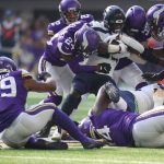 MINNEAPOLIS, MINNESOTA - SEPTEMBER 26: Chris Carson #32 of the Seattle Seahawks is tackled by Anthony Barr #55 and Mackensie Alexander #24 of the Minnesota Vikings during the first quarter in the game at U.S. Bank Stadium on September 26, 2021 in Minneapolis, Minnesota. (Photo by David Berding/Getty Images)