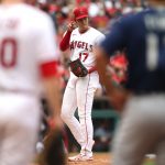 ANAHEIM, CALIFORNIA - SEPTEMBER 26: Shohei Ohtani #17 of the Los Angeles Angels signals to Jared Walsh #20 of the Los Angeles Angels during the fifth inning against the Seattle Mariners at Angel Stadium of Anaheim on September 26, 2021 in Anaheim, California. (Photo by Katharine Lotze/Getty Images)