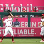 ANAHEIM, CALIFORNIA - SEPTEMBER 26: Phil Gosselin #13 of the Los Angeles Angels catches a pop fly during the fifth inning against the Seattle Mariners at Angel Stadium of Anaheim on September 26, 2021 in Anaheim, California. (Photo by Katharine Lotze/Getty Images)