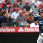 ANAHEIM, CALIFORNIA - SEPTEMBER 26: Tom Murphy #2 of the Seattle Mariners high-fives Jarred Kelenic #10 who hit a home run in the seventh inning against the Los Angeles Angels at Angel Stadium of Anaheim on September 26, 2021 in Anaheim, California. (Photo by Katharine Lotze/Getty Images)