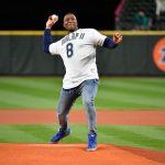 SEATTLE, WASHINGTON - SEPTEMBER 27:  Carlos Dunlap II #8 of the NFL Seattle Seahawks throws the ceremonial first pitch before the game between the Seattle Mariners and the Oakland Athletics at T-Mobile Park on September 27, 2021 in Seattle, Washington. (Photo by Alika Jenner/Getty Images)