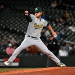 SEATTLE, WASHINGTON - SEPTEMBER 27: Cole Irvin #19 of the Oakland Athletics throws a pitch during the first inning against the Seattle Mariners at T-Mobile Park on September 27, 2021 in Seattle, Washington. (Photo by Alika Jenner/Getty Images)