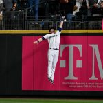 SEATTLE, WASHINGTON - SEPTEMBER 27:  Mitch Haniger #17 of the Seattle Mariners misplays a ball off the bat of Seth Brown of the Oakland Athletics that cleared the wall for a home run ball in the first inning at T-Mobile Park on September 27, 2021 in Seattle, Washington. (Photo by Alika Jenner/Getty Images)