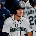 SEATTLE, WASHINGTON - SEPTEMBER 28: Jarred Kelenic #10 of the Seattle Mariners looks on in the dugout after scoring during the fourth inning against the Oakland Athletics at T-Mobile Park on September 28, 2021 in Seattle, Washington. (Photo by Alika Jenner/Getty Images)