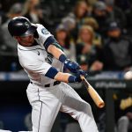 SEATTLE, WASHINGTON - SEPTEMBER 28: Mitch Haniger #17 of the Seattle Mariners hits a solo home run during the seventh inning against the Oakland Athletics at T-Mobile Park on September 28, 2021 in Seattle, Washington. (Photo by Alika Jenner/Getty Images)