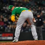 SEATTLE, WASHINGTON - SEPTEMBER 29: Frankie Montas #47 of the Oakland Athletics checks the first base runner during the fourth inning against the Oakland Athletics at T-Mobile Park on September 29, 2021 in Seattle, Washington. (Photo by Alika Jenner/Getty Images)