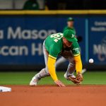 SEATTLE, WASHINGTON - SEPTEMBER 29: Matt Chapman #26 of the Oakland Athletics fails to handle the ball during the fifth inning against the Seattle Mariners at T-Mobile Park on September 29, 2021 in Seattle, Washington. (Photo by Alika Jenner/Getty Images)