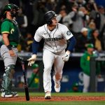 SEATTLE, WASHINGTON - SEPTEMBER 29: Jarred Kelenic #10 of the Seattle Mariners hits a two-run double in the sixth inning against the Oakland Athletics at T-Mobile Park on September 29, 2021 in Seattle, Washington. (Photo by Alika Jenner/Getty Images)