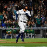 SEATTLE, WASHINGTON - SEPTEMBER 29: Abraham Toro #13 of the Seattle Mariners hits a solo home run during the eighth inning against the Oakland Athletics at T-Mobile Park on September 29, 2021 in Seattle, Washington. (Photo by Alika Jenner/Getty Images)