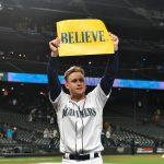 SEATTLE, WASHINGTON - SEPTEMBER 29: Jarred Kelenic #10 of the Seattle Mariners holds up a "Believe" sign after the game against the Oakland Athletics at T-Mobile Park on September 29, 2021 in Seattle, Washington. The Mariners won 4-2. (Photo by Alika Jenner/Getty Images)