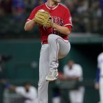 
              Los Angeles Angels starting pitcher Janson Junk winds up to deliver to the Texas Rangers in the first inning of a baseball game in Arlington, Texas, Wednesday, Sept. 29, 2021. (AP Photo/Tony Gutierrez)
            