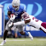 
              Memphis running back Rodrigues Clark (2) breaks a tackle by Mississippi State safety Jay Jimison (36) during an NCAA college football game Saturday, Sept. 18, 2021, in Memphis, Tenn. (Patrick Lantrip/Daily Memphian via AP)
            
