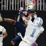 
              Georgia Tech wide receiver Malachi Carter (7) makes a catch for a touchdown as North Carolina defensive back Kyler McMichael (1) defends during the second half of an NCAA college football game, Saturday, Sept. 25, 2021, in Atlanta. (AP Photo/John Bazemore)
            