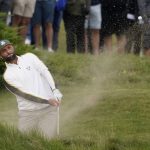 
              Team Europe's Jon Rahm hits from a bunker on the first hole during a practice day at the Ryder Cup at the Whistling Straits Golf Course Wednesday, Sept. 22, 2021, in Sheboygan, Wis. (AP Photo/Jeff Roberson)
            