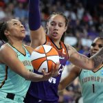 
              New York Liberty guard/forward Betnijah Laney (44) shoots in front of Phoenix Mercury center Brittney Griner (42) during the second half in the first round of the WNBA basketball playoffs, Thursday, Sept. 23, 2021, in Phoenix. Phoenix won 83-82. (AP Photo/Rick Scuteri)
            