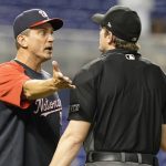 
              Washington Nationals bench coach Tim Bogar, left, argues a call with home plate umpire Adam Beck during the 10th inning of a baseball game against the Miami Marlins, Monday, Sept. 20, 2021, in Miami. (AP Photo/Marta Lavandier)
            