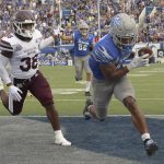 
              Memphis wide receiver Calvin Austin III (4) makes a reception for a touchdown as Mississippi State safety Fred Peters (38) follows during the second half of an NCAA college football game on Saturday, Sept. 18, 2021, in Memphis, Tenn. (AP Photo/John Amis)
            
