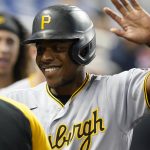 
              Pittsburgh Pirates Ke'Bryan Hayes (13) is greeted by the team after scoring during the first inning of the team's baseball game against the Miami Marlins, Saturday, Sept. 18, 2021, in Miami. (AP Photo/Marta Lavandier)
            