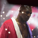
              Former heavyweight champ Evander Holyfield walks into the ring for his boxing match against former MMA star Vitor Belfort, Saturday, Sept. 11, 2021, in Hollywood, Fla. (AP Photo/Rebecca Blackwell)
            