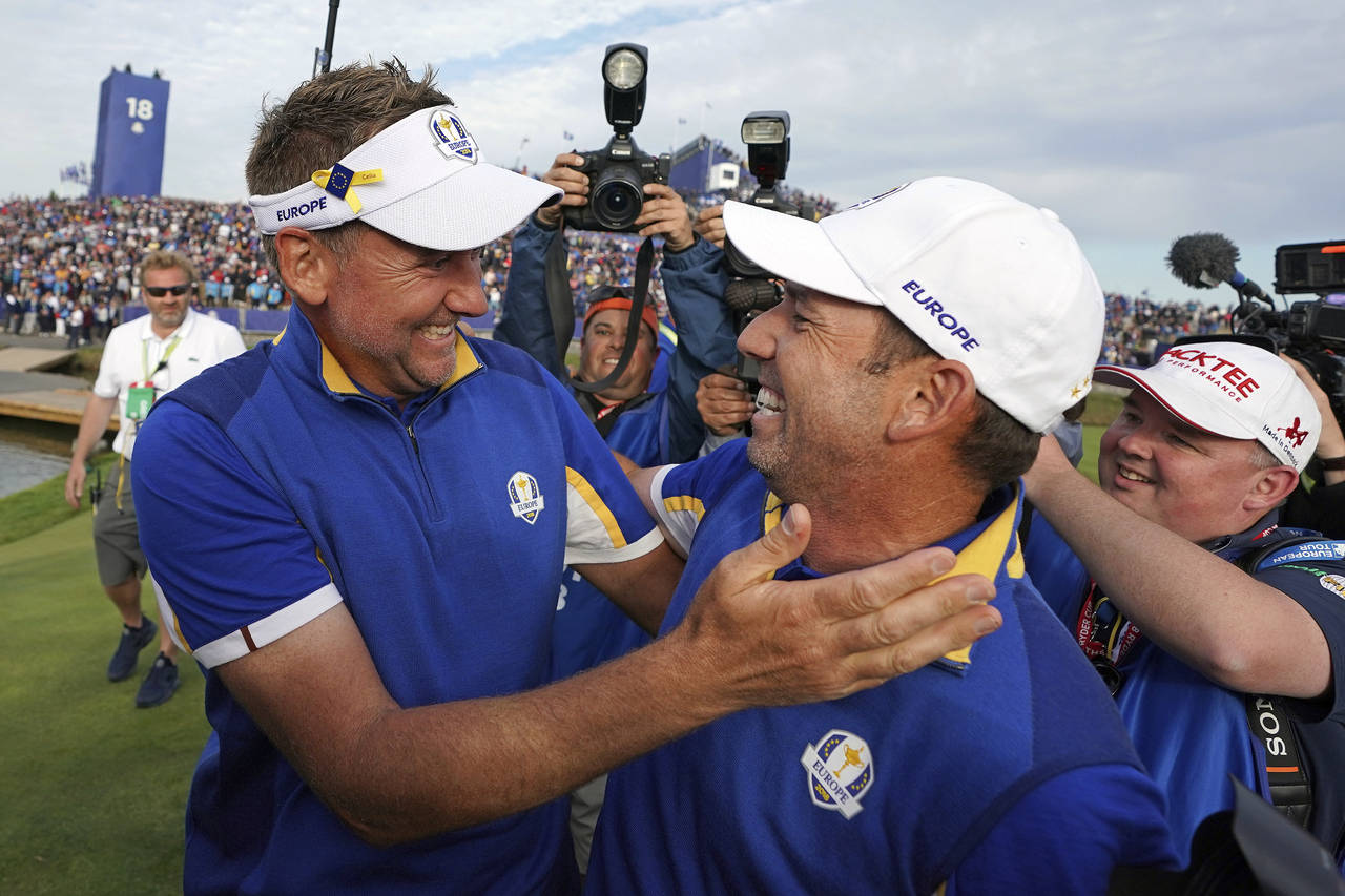 FILE - In this Sept. 30, 2018, file photo, Europe's Sergio Garcia, right, celebrates with Ian Poult...