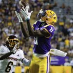 
              LSU wide receiver Brian Thomas Jr. (11) catches a pass next to Central Michigan defensive back Daedae Hill (6) during the second quarter of an NCAA college football game in Baton Rouge, La,. Saturday, Sept. 18, 2021. (AP Photo/Derick Hingle)
            