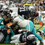 
              Las Vegas Raiders running back Peyton Barber (31) dives in for a touchdown against the Miami Dolphins during the second half of an NFL football game, Sunday, Sept. 26, 2021, in Las Vegas. (AP Photo/Rick Scuteri)
            