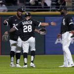 
              The Chicago White Sox outfielders Eloy Jimenez, Leury Garcia and Luis Robert, from left, celebrate the team's 9-3 win over the Los Angeles Angels in a baseball game Tuesday, Sept. 14, 2021, in Chicago. (AP Photo/Charles Rex Arbogast)
            
