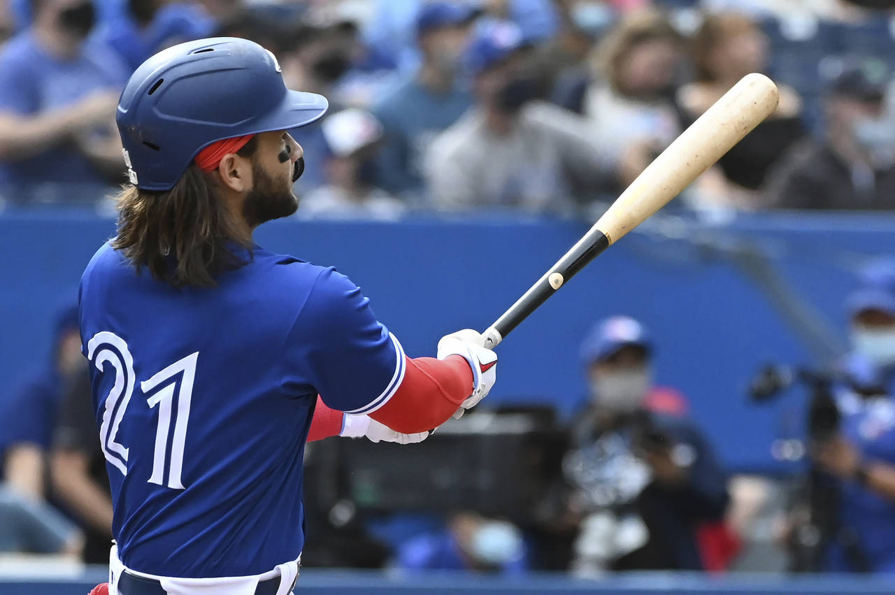 Toronto Blue Jays' Bo Bichette watches his three-run home run in the first inning in the first inni...